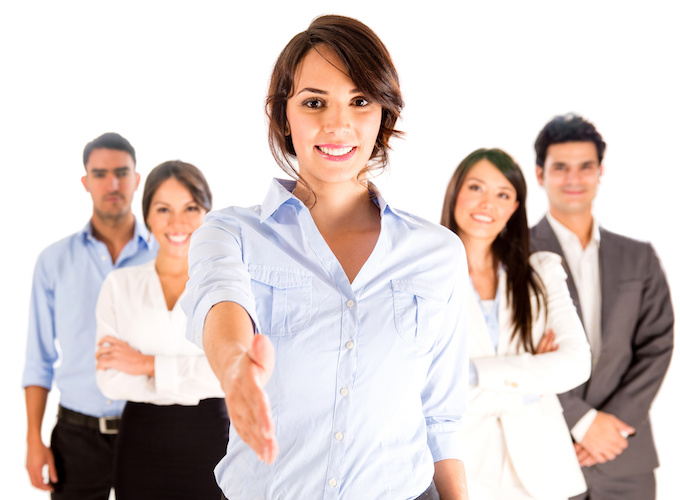 Business handshake Business woman with hand extended to handshake - isolated over white